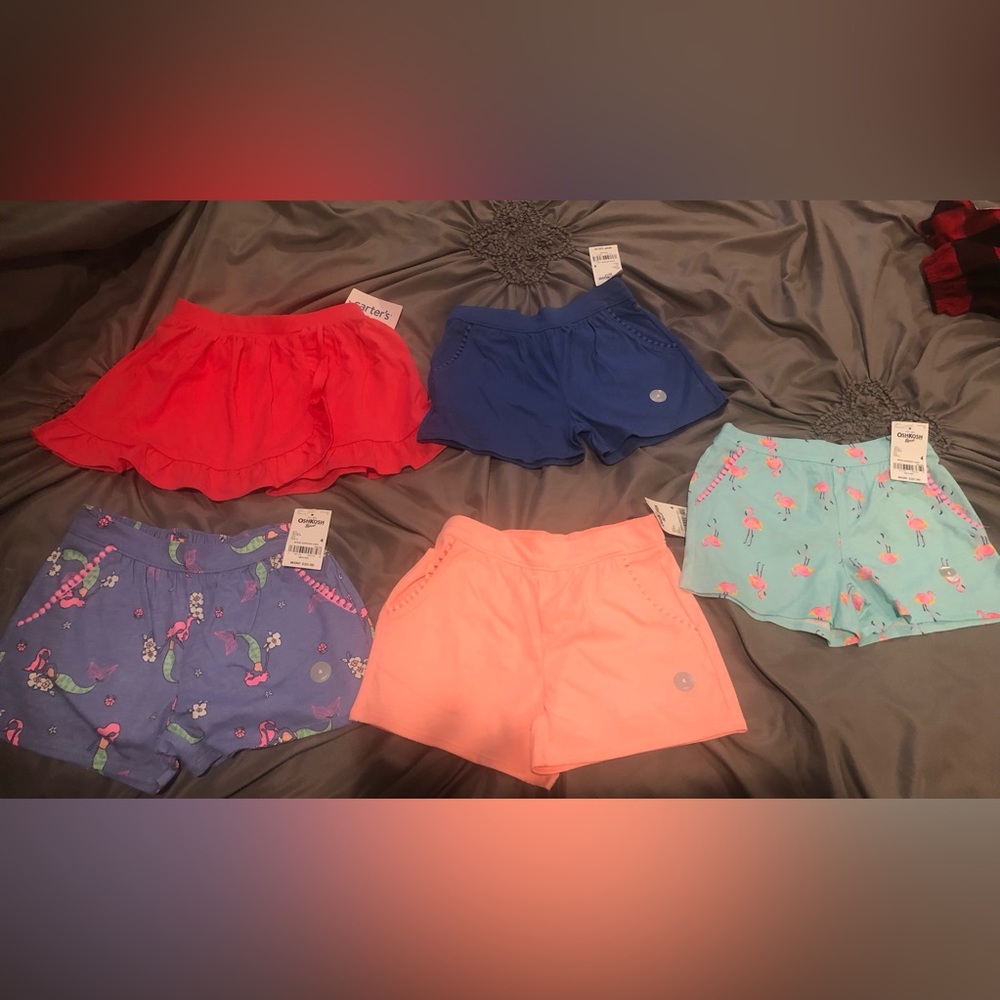 4 pairs of shorts and 1 skort, all new with tags, size 4T